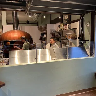 a man working behind a counter