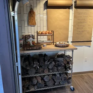 a rack of firewood in a kitchen