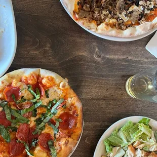 The Margherita Pizza with pepperoni added. Caesar Salad, Toscana Pizza.