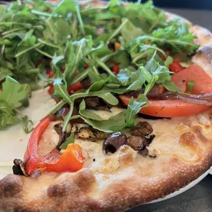 Vegetarian Pizza with arugula and tomato