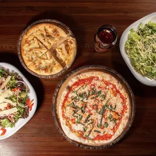 a variety of pizzas and salads