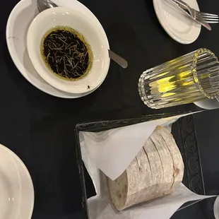 a plate of pasta and a burrito