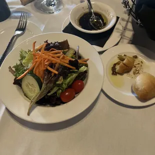 House salad and vinaigrette with warm melting buns in a succulent oil dip!