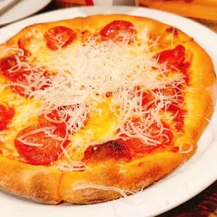 a pizza with pepperoni and cheese