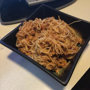 a plate of spaghetti with meat
