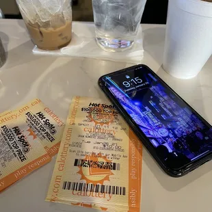 a phone and a ticket on a table