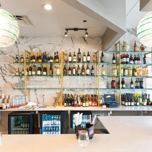 a bar with bottles of wine