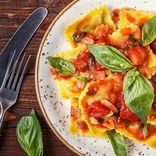 Handmade ricotta and spinach filled ravioli