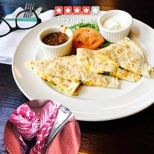 Yummies!  Quesadilla with two cheeses, green chilies served with roasted tomato salsa and sour cream. Success!