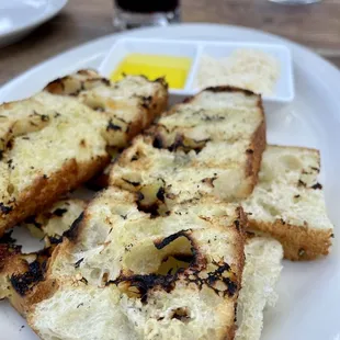 Grilled focaccia with olive oil.  Tasty &amp; fresh.  Some of our entrees came with bread so may not be necessary to order separately.