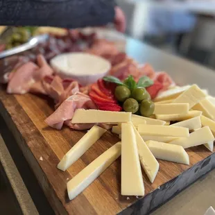 a variety of cheeses and meats