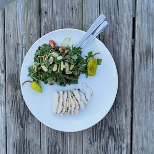 a plate of food on a wooden table