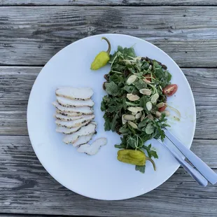 a plate of food on a wooden table