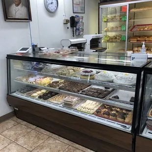 a display case with a variety of pastries