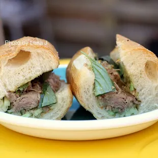 Duck Confit Bánh Mì ($15): lemongrass, avocado pate, pickles, cilantro