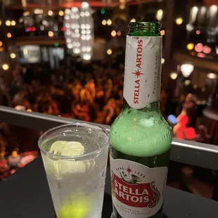 a bottle of beer and a glass of lemonade