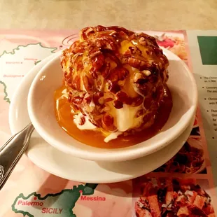 Pecan ball with butterscotch. Vanilla ice cream rolled in nuts and drizzled with either butterscotch or chocolate sauce.