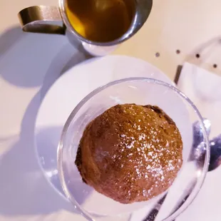a cup of coffee and a spoon on a table