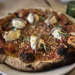 a pizza on a plate on a table