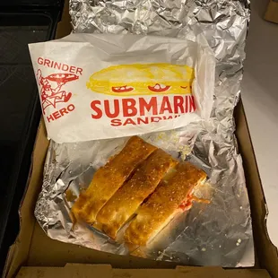 Small ohana,aloha style calzone &amp; all thats left of a LARGE pastrami sub( pickles on the side )