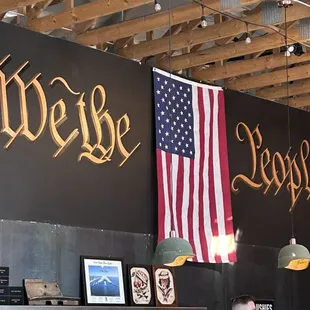 the american flag hanging from the ceiling
