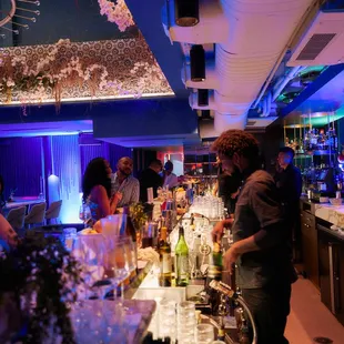 a group of people at a bar