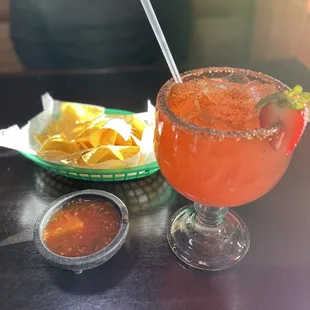 Chips and salsa and strawberry jalapeño Margarita