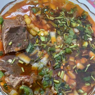 a bowl of beef and vegetable soup