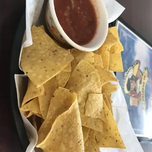 a plate of chips and salsa