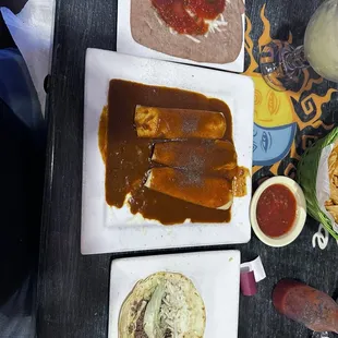 Cheese, enchiladas, soft taco, refried beans.