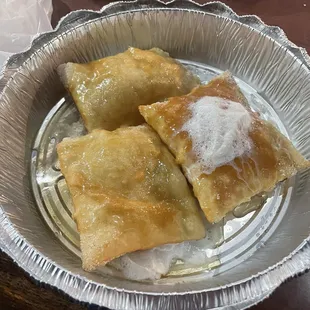 Sopapillas with cinnamon, sugar, served warm with lots of drizzled honey and topped off with whipped cream.  So good.