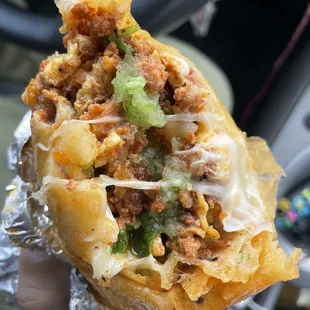 Breakfast burrito (chorizo, potatoes, egg, and Monterey Jack cheese) topped with their delicious green sauce!