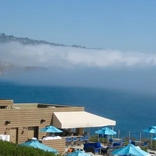 a view of the ocean from the top of a hill