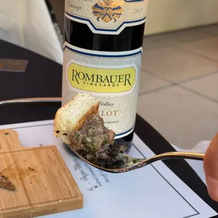 a bottle of wine and a cutting board