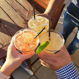 a group of people toasting with drinks