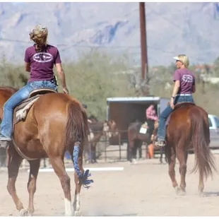 Sheryl's daughter on the left and Sheryl on the right. Warming up their horses at a local schooling show.