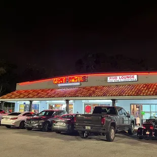 the outside of a restaurant at night