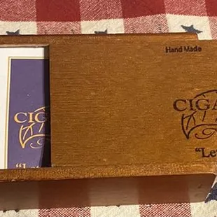 Cigars, matches, and wooden cigar box