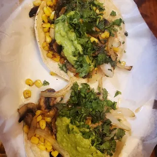 Hongos tacos. Tacos filled with mushrooms, onions, corn and guac. Prettt good flavor but Too greasy for me.
