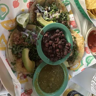 Taconteno with green sauce and beer