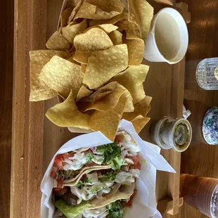 Steak tacos, queso and chips.