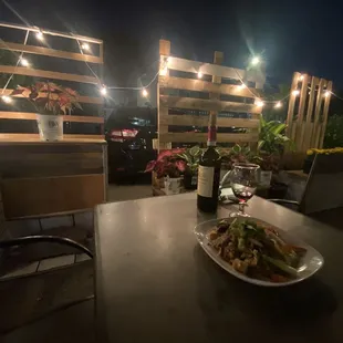 a plate of food and a bottle of wine