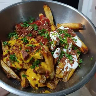 a person holding a bowl of food
