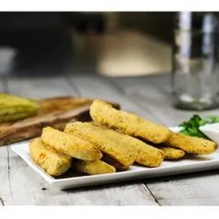 a plate of fried zucchini sticks