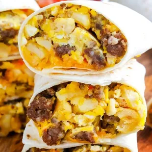 a stack of breakfast burritos