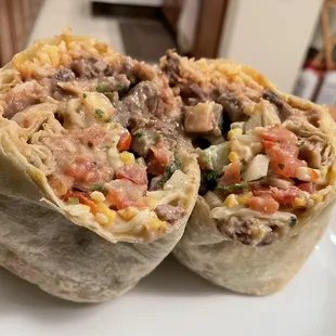 Carne Asada burrito w/rice, refried beans, extra pico de gallo, and creamy cilantro salsa!  Very big and very good!