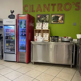 a kitchen with a refrigerator and a counter