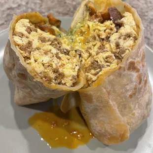 Chorizo, egg, potato, and cheese breakfast burrito w/creamy cilantro sauce! Delicious!