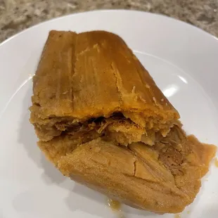 Red Pork tamale! Not a fan! Ratio of meat to masa is off!