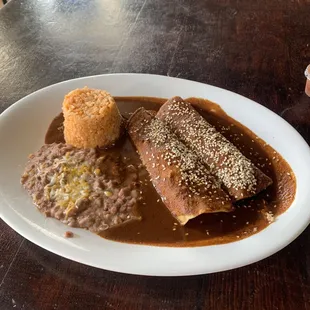 Enchiladas de mole 2 Chicken Enchilada Rice and Beans Combo Plate